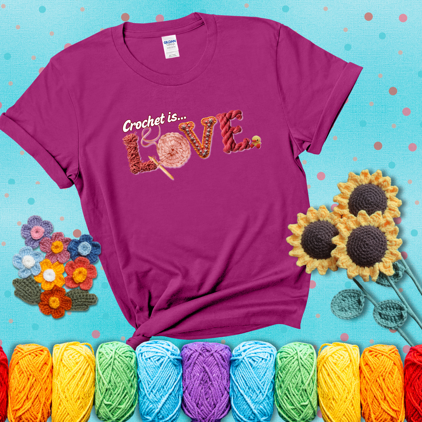 The word "LOVE" spelled with different crochet textures and yarn in red tones, with the phrase “Crochet is…” above in script. showing a purple tee with a teal sunflower background