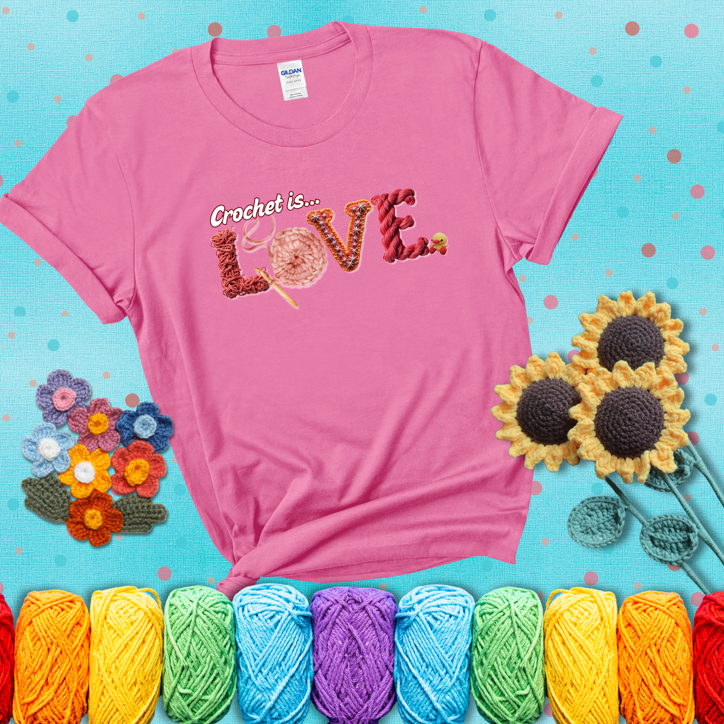 The word "LOVE" spelled with different crochet textures and yarn in red tones, with the phrase “Crochet is…” above in script. showing a light purple tee with a teal sunflower background