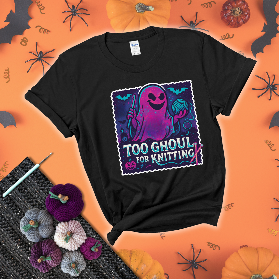 A spooky ghost holds a yarn ball and crochet hook in a vibrant Halloween palette with bats, tombstones, and pumpkins wearing a black tee with a festive halloween background