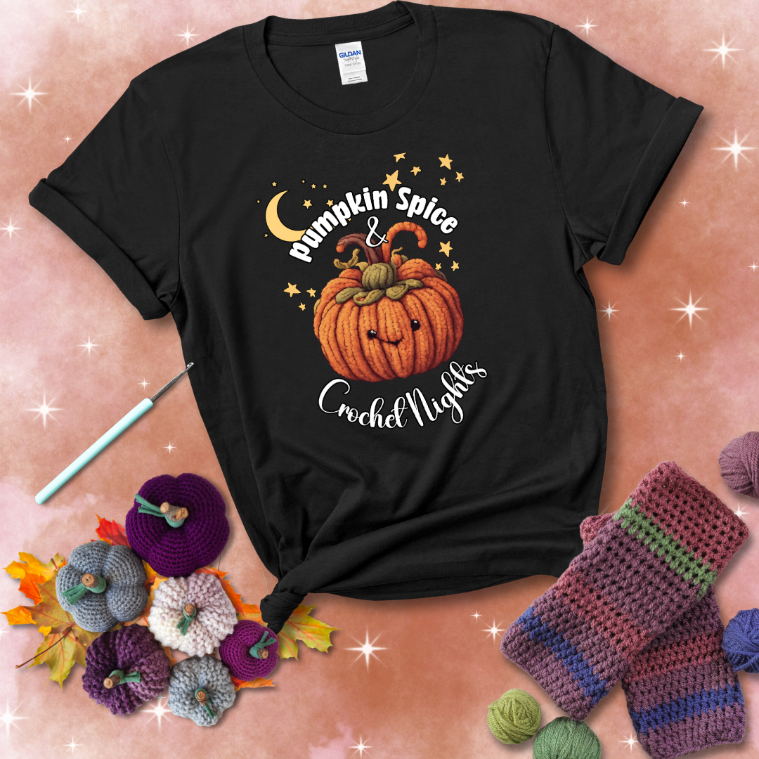 Smiling pumpkin crocheted with yarn texture, surrounded by stars and a crescent moon. Text reads “Pumpkin Spice & Crochet Nights” showing a black tee with a festive Fall background