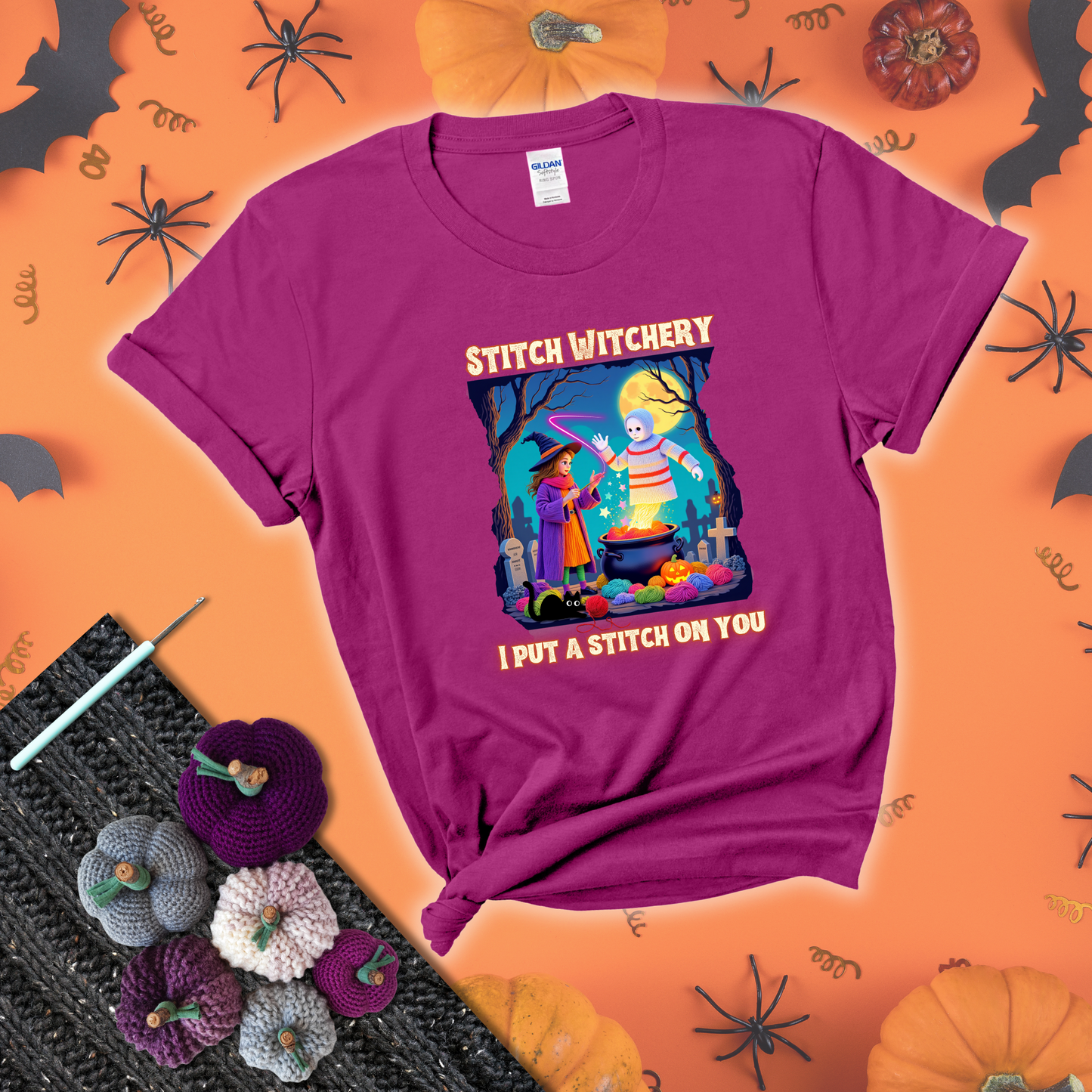 A Halloween scene with a young witch casting a yarn spell from a cauldron onto a floating crochet-ghost figure, under the phrase “I Put a Stitch on You” showing a magenta tee with a festive Halloween background