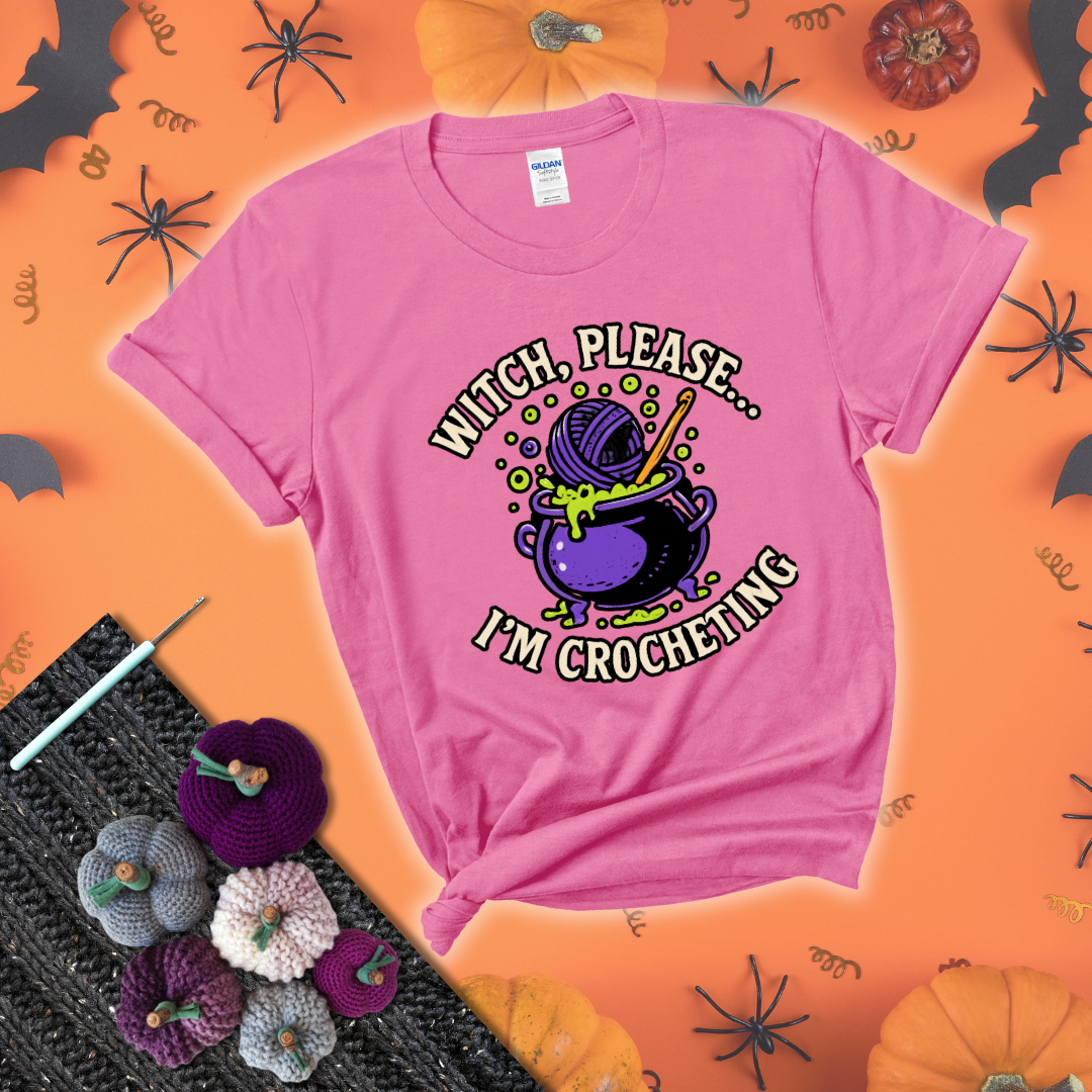 Put a spell on your stash Design reads 'Witch, Please… I’m Crocheting,' perfect crochet gift for yarn lovers showing a pink tee with a festive Halloween background