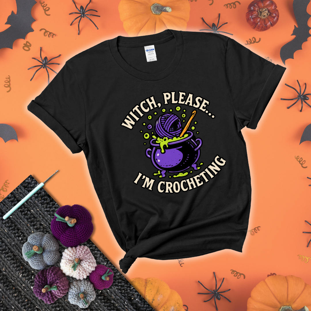 Put a spell on your stash Design reads 'Witch, Please… I’m Crocheting,' perfect crochet gift for yarn lovers showing a black tee with a festive Halloween background