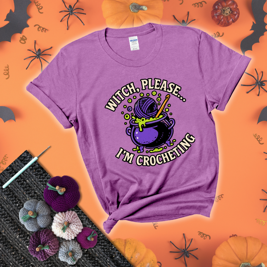 Put a spell on your stash Design reads 'Witch, Please… I’m Crocheting,' perfect crochet gift for yarn lovers showing a light purple tee with a festive Halloween background