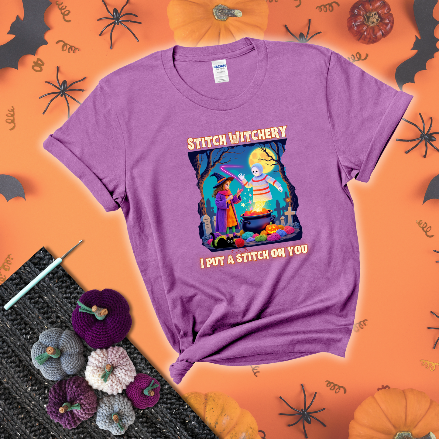 A Halloween scene with a young witch casting a yarn spell from a cauldron onto a floating crochet-ghost figure, under the phrase “I Put a Stitch on You” showing a light purple tee with a festive Halloween background