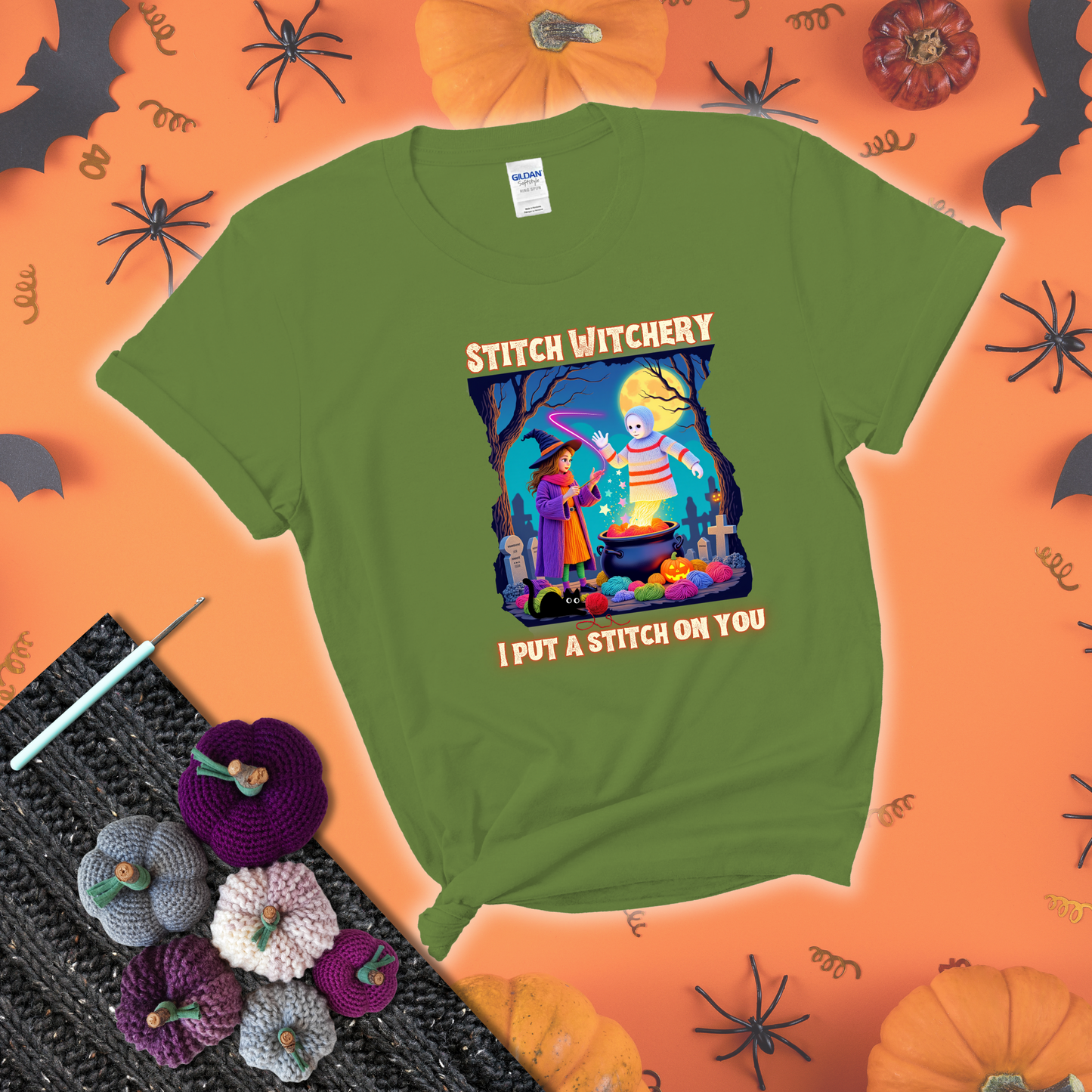 A Halloween scene with a young witch casting a yarn spell from a cauldron onto a floating crochet-ghost figure, under the phrase “I Put a Stitch on You” showing a bright green tee with a festive Halloween background