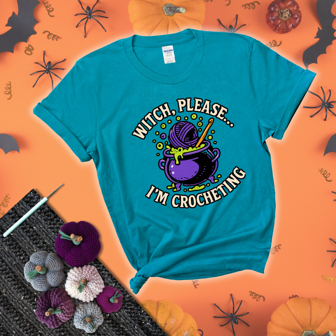 Put a spell on your stash Design reads 'Witch, Please… I’m Crocheting,' perfect crochet gift for yarn lovers showing a blue-green tee with a festive Halloween background