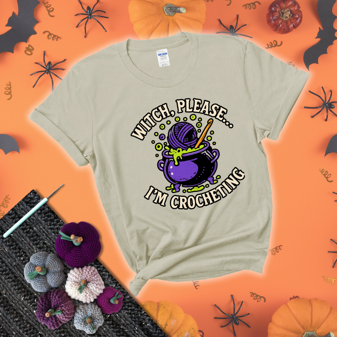 Put a spell on your stash Design reads 'Witch, Please… I’m Crocheting,' perfect crochet gift for yarn lovers showing a beige tee with a festive Halloween background