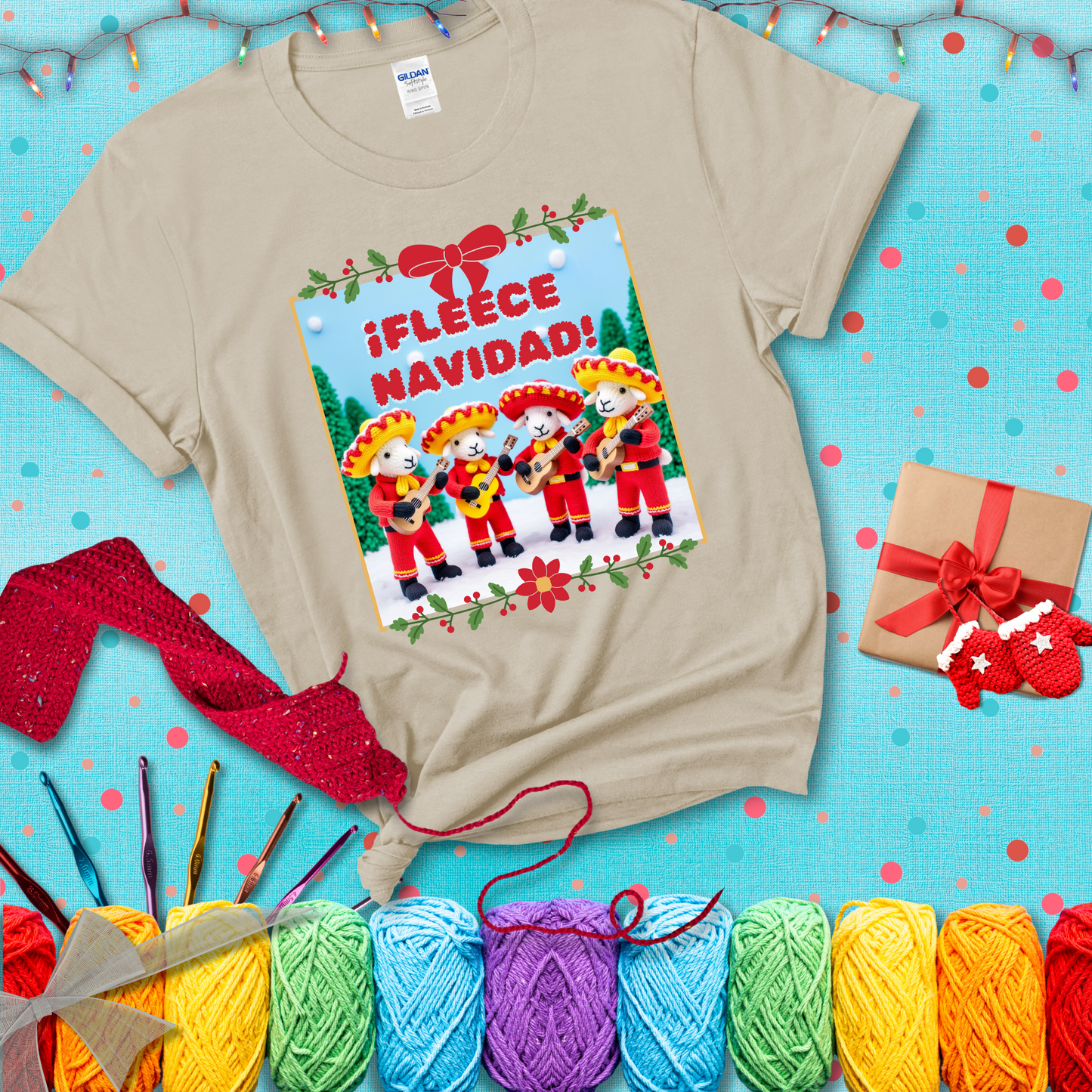 Four crocheted sheep dressed in red mariachi outfits with guitars, standing in a snowy scene under the phrase “¡Fleece Navidad!” showing a beige tee with a festive Christmas background