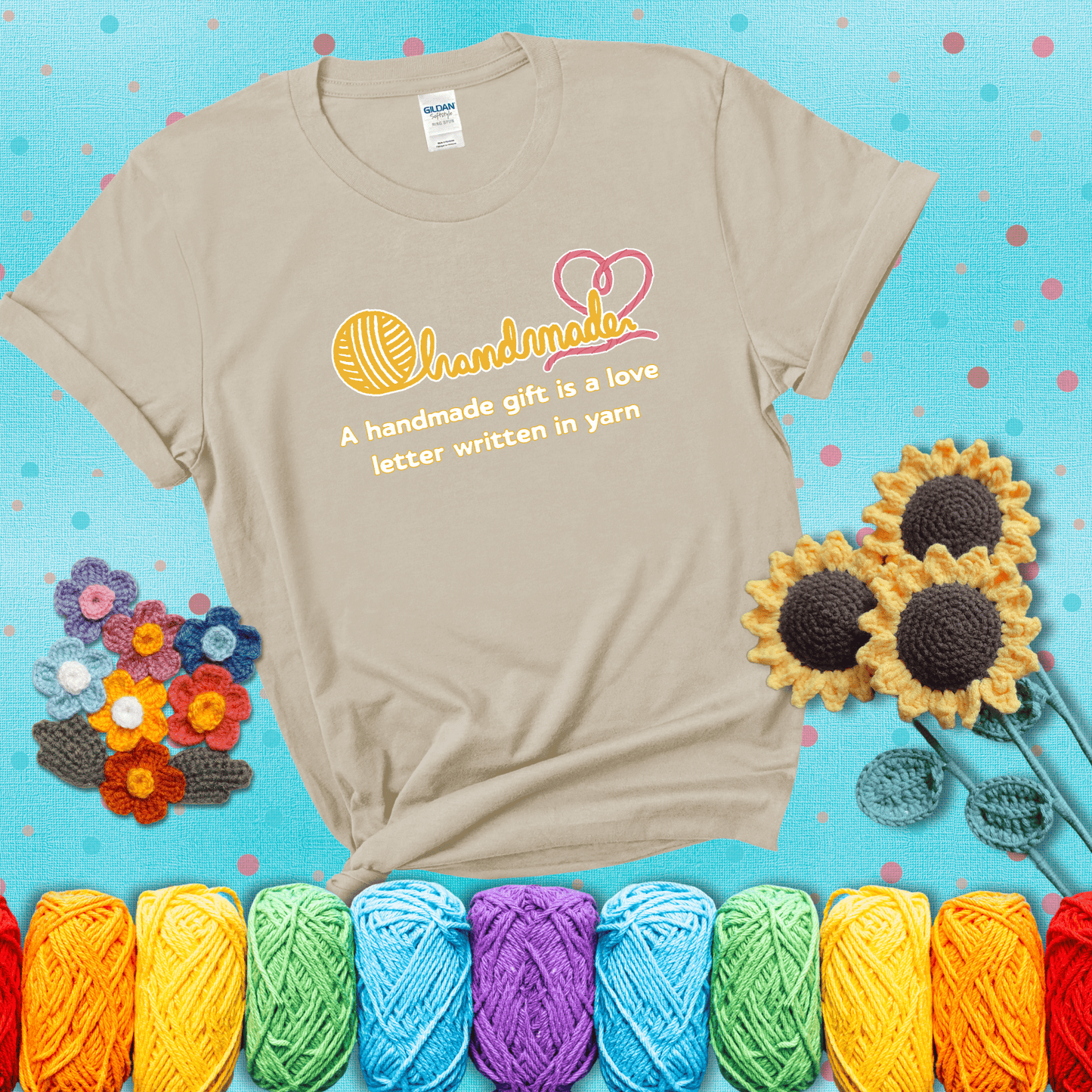 Soft script-style design with heart detail. Text reads: “A Handmade Gift Is a Love Letter Written in Yarn.” A sweet and sentimental shirt for crocheters who craft from the heart, showing a beige tee with a teal sunflower background