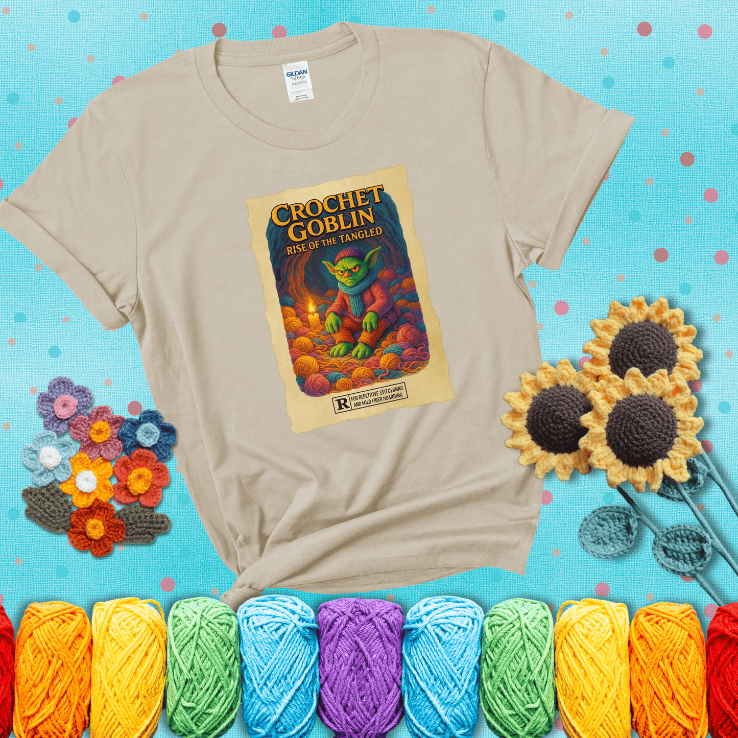 Crochet goblin surrounded by chaotic yarn stash in a cave-like lair. Text reads: “Crochet Goblin: Rise of the Tangled.” A funny fantasy-style tee for yarn hoarders and goblin-mode crafters. showing a beige tee with a teal sunflower background