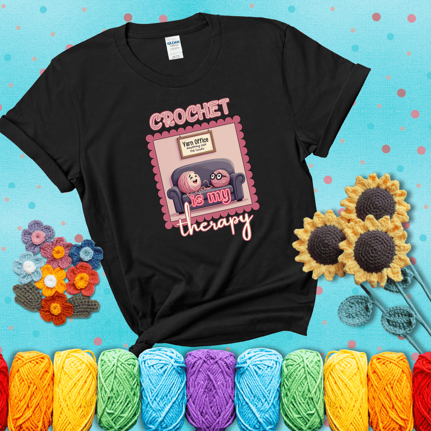 Simple text design with soothing yarn elements. Text reads: “Crochet is My Therapy.” A calming tee for fiber lovers who find healing in every stitch; showing a black tee with a teal sunflower background