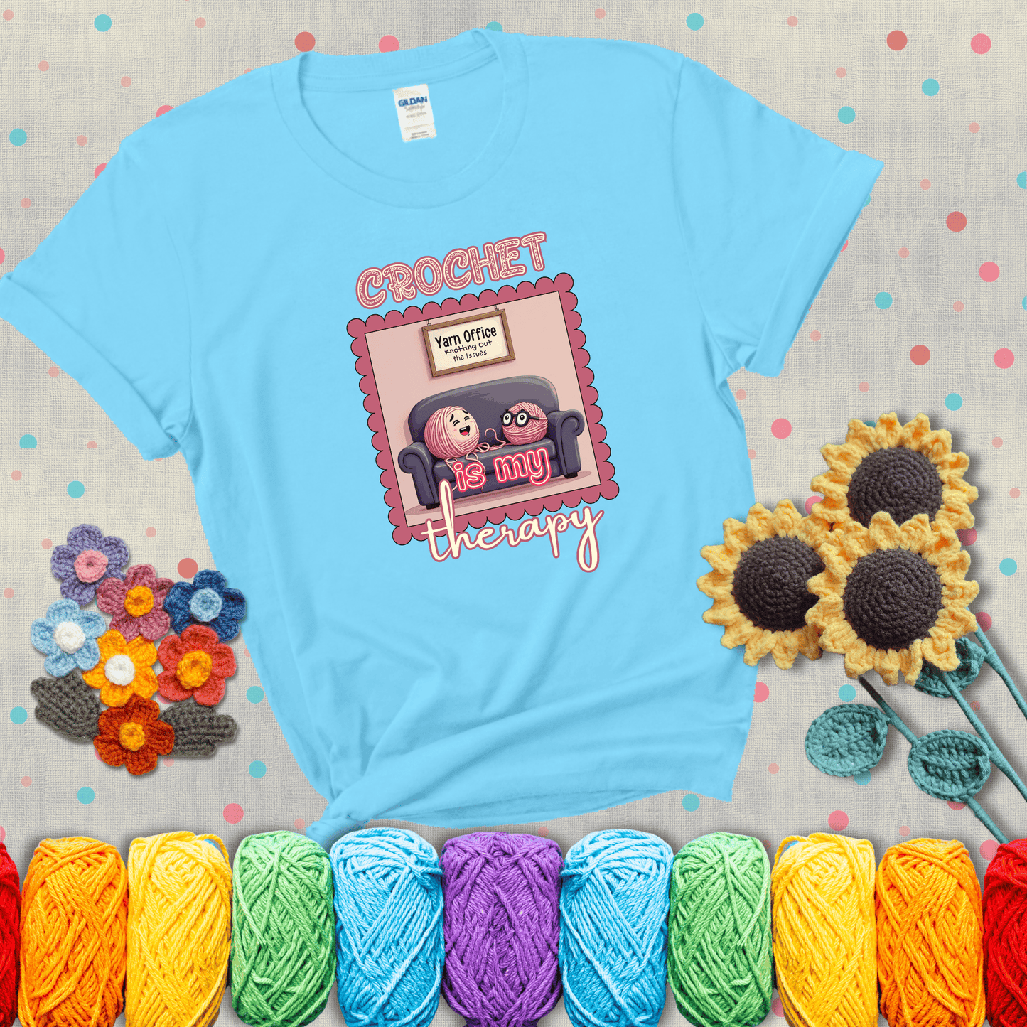 Simple text design with soothing yarn elements. Text reads: “Crochet is My Therapy.” A calming tee for fiber lovers who find healing in every stitch; showing a light blue tee with grey sunflower background