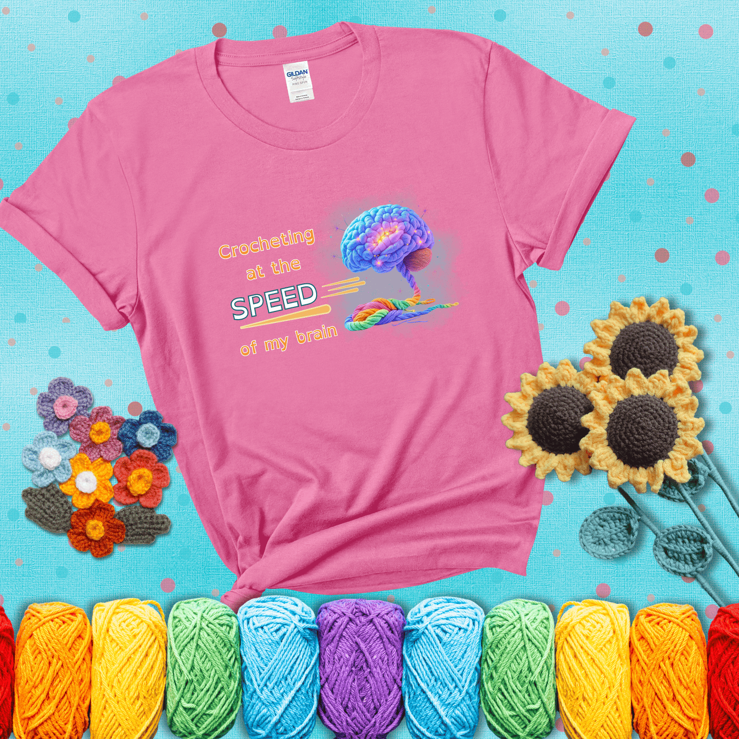 A glowing rainbow brain unravels into colorful yarn with the phrase “Crocheting at the speed of my brain;" showing a pink tee with a teal sunflower background