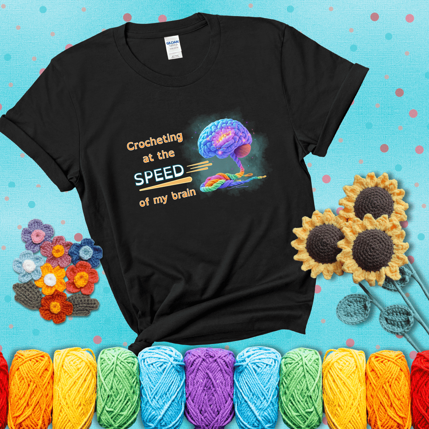 A glowing rainbow brain unravels into colorful yarn with the phrase “Crocheting at the speed of my brain;" showing a black tee with a teal sunflower background
