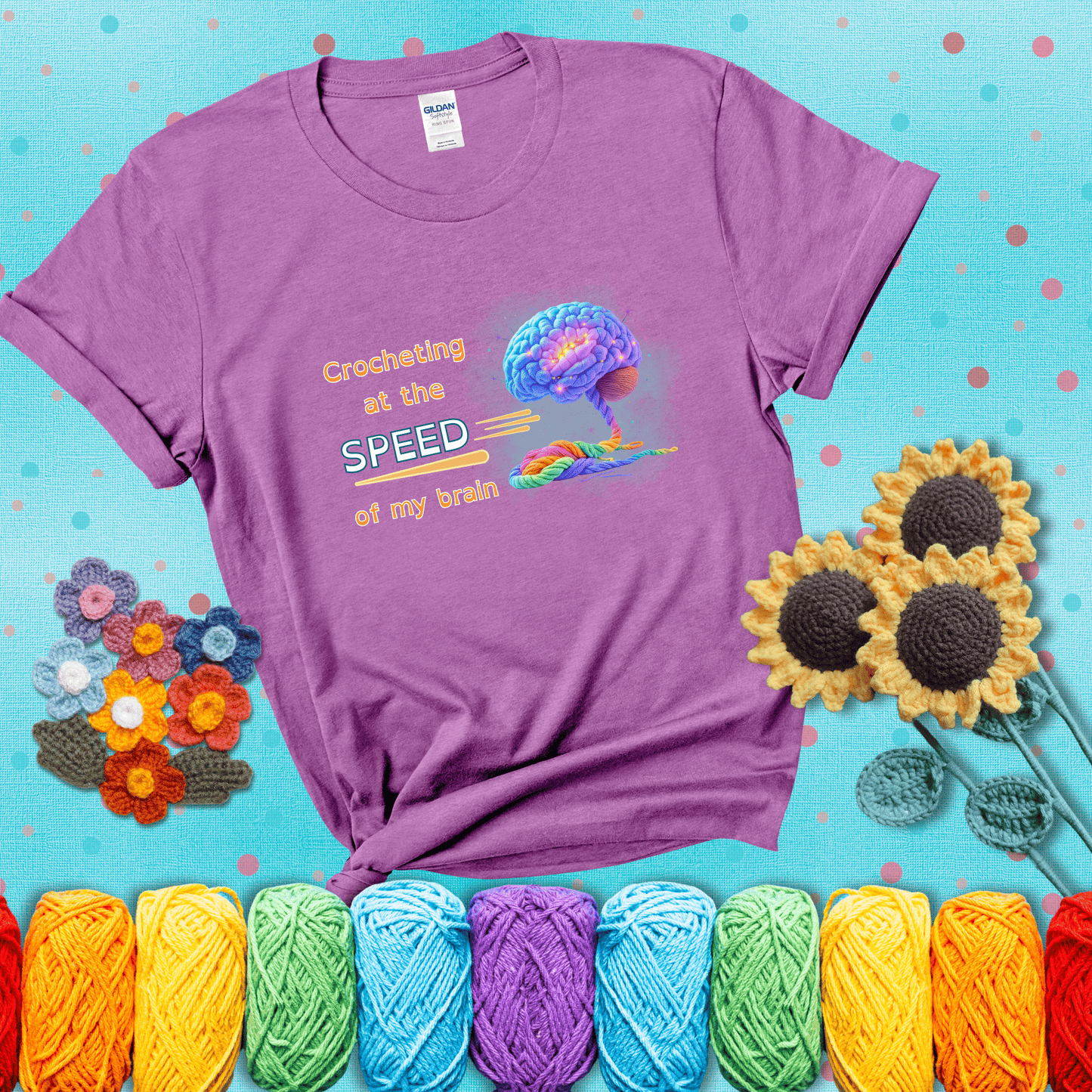 A glowing rainbow brain unravels into colorful yarn with the phrase “Crocheting at the speed of my brain;" showing a light purple tee with a teal sunflower background