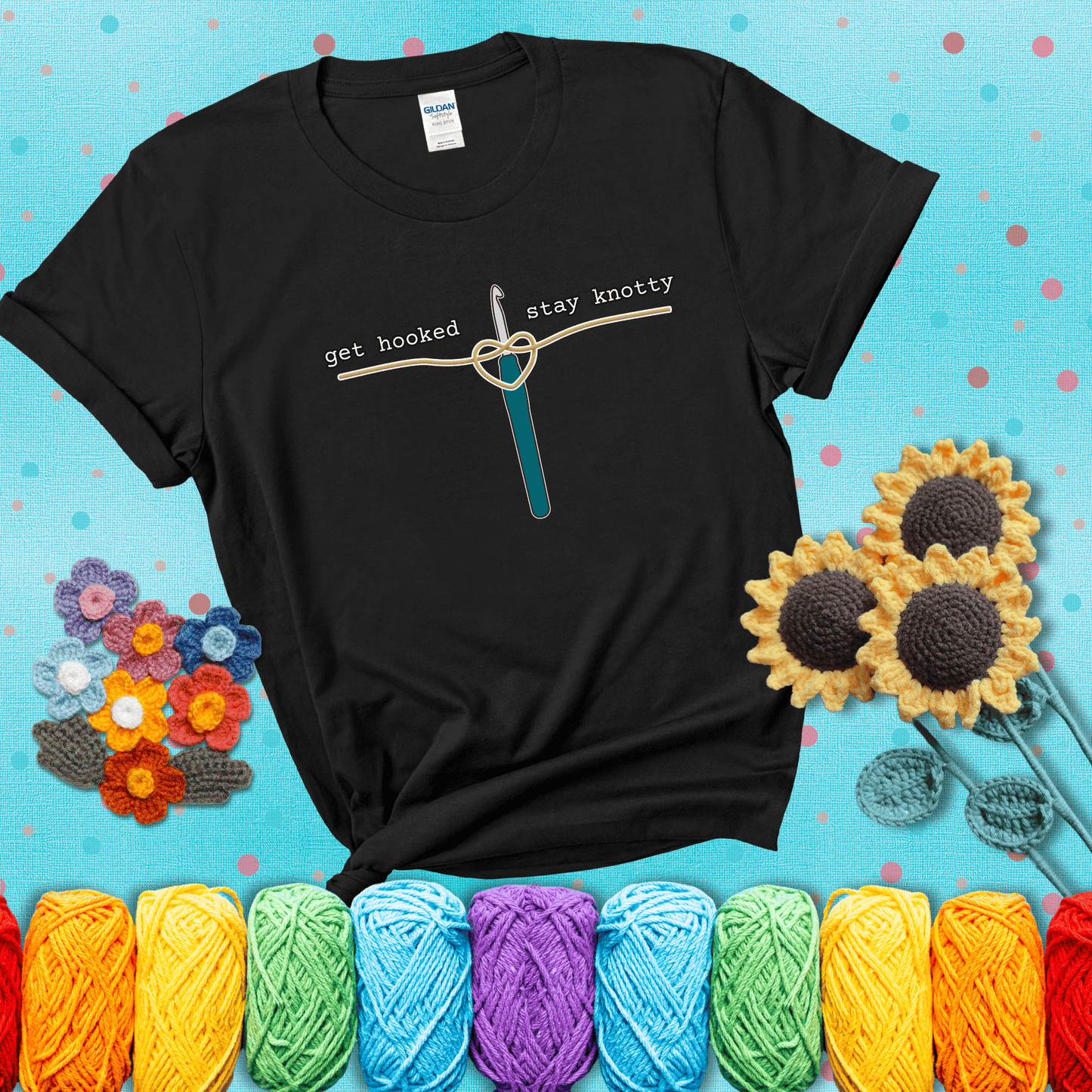Hooked on yarn? Same Design reads 'Get Hooked, Stay Knotty' , perfect crochet gift for yarn lovers, showing a black tee with a teal sunflower background