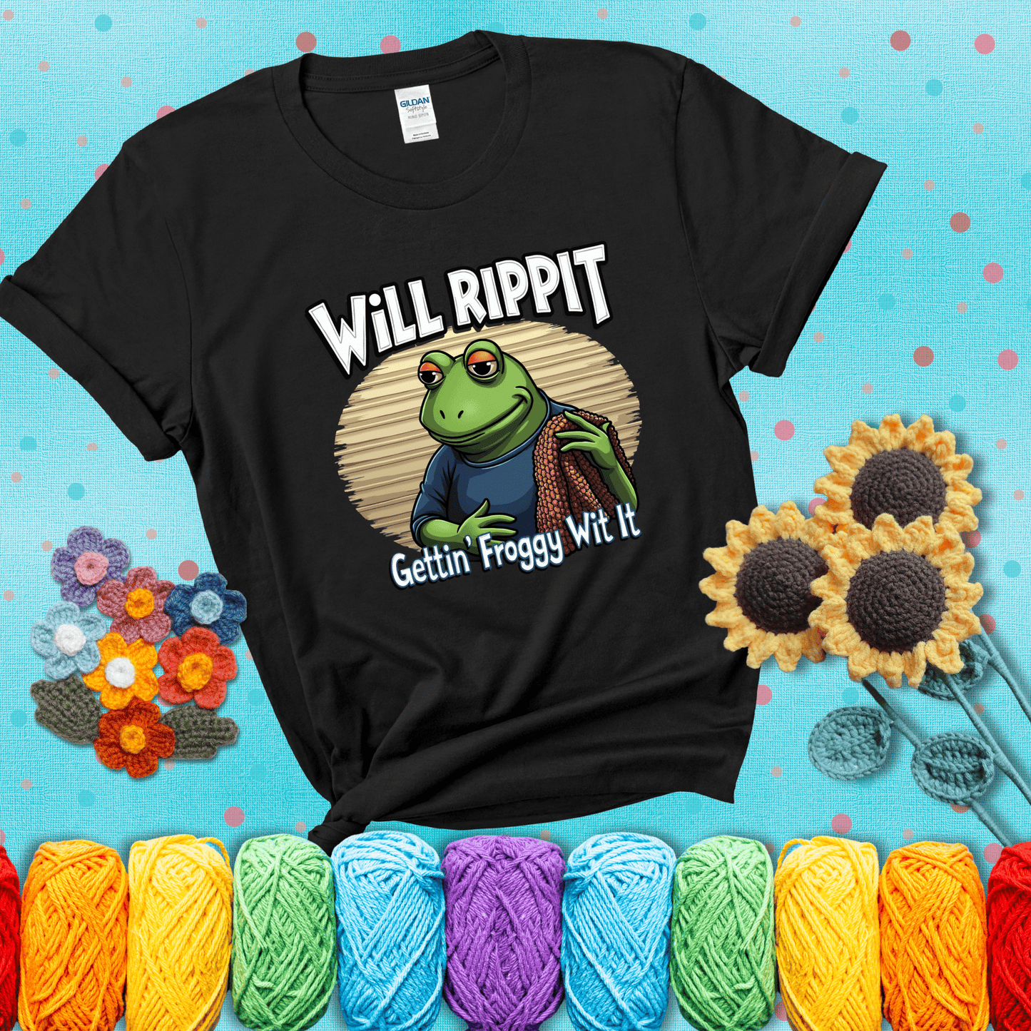 Cool frog with sunglasses, surrounded by yarn and hooks. Text reads: “Gettin’ Froggy Wit It.” A hip and humorous crochet tee for yarn lovers with rhythm, showing a black tee with a teal sunflower background