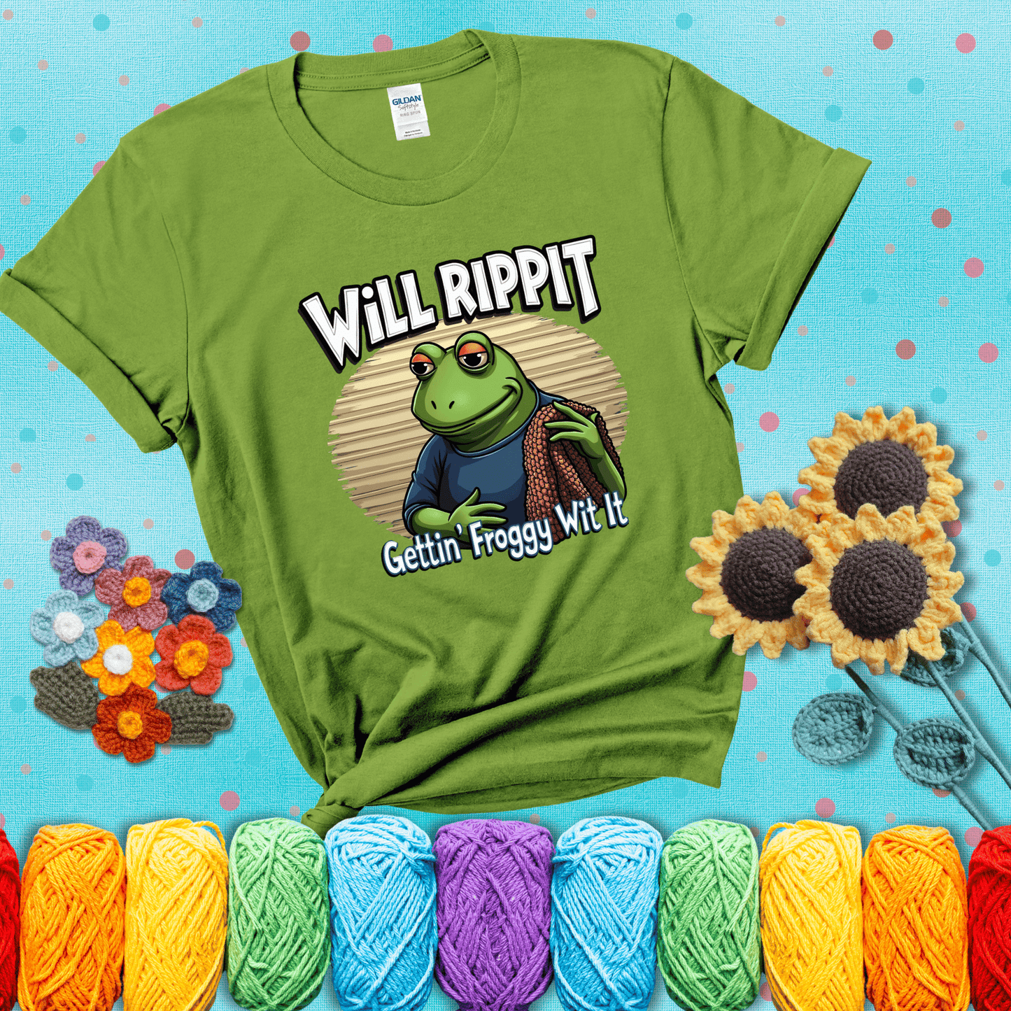 Cool frog with sunglasses, surrounded by yarn and hooks. Text reads: “Gettin’ Froggy Wit It.” A hip and humorous crochet tee for yarn lovers with rhythm, showing a bright green tee with a teal sunflower background
