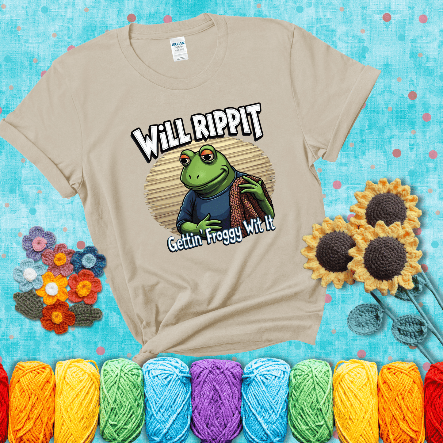 Cool frog with sunglasses, surrounded by yarn and hooks. Text reads: “Gettin’ Froggy Wit It.” A hip and humorous crochet tee for yarn lovers with rhythm, showing a beige tee with a teal sunflower background