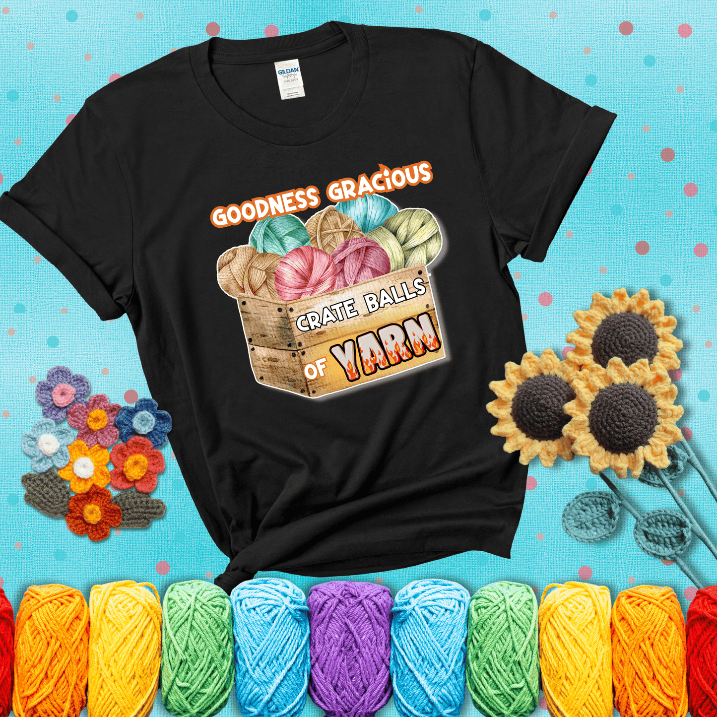 Wooden crate filled with colorful yarn balls and bold text “Goodness Gracious, Crate Balls of Yarn” with flame effects, a funny gift for crocheters showing a black tee with a teal sunflower background