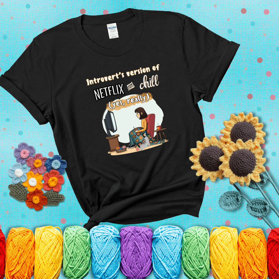 A girl with a crochet hook sits under a granny square blanket watching TV, with yarn, a coffee mug, and a cat at her feet. Text says “Introvert’s version of Netflix and chill (yes, really)," showing a black tee with a teal sunflower background