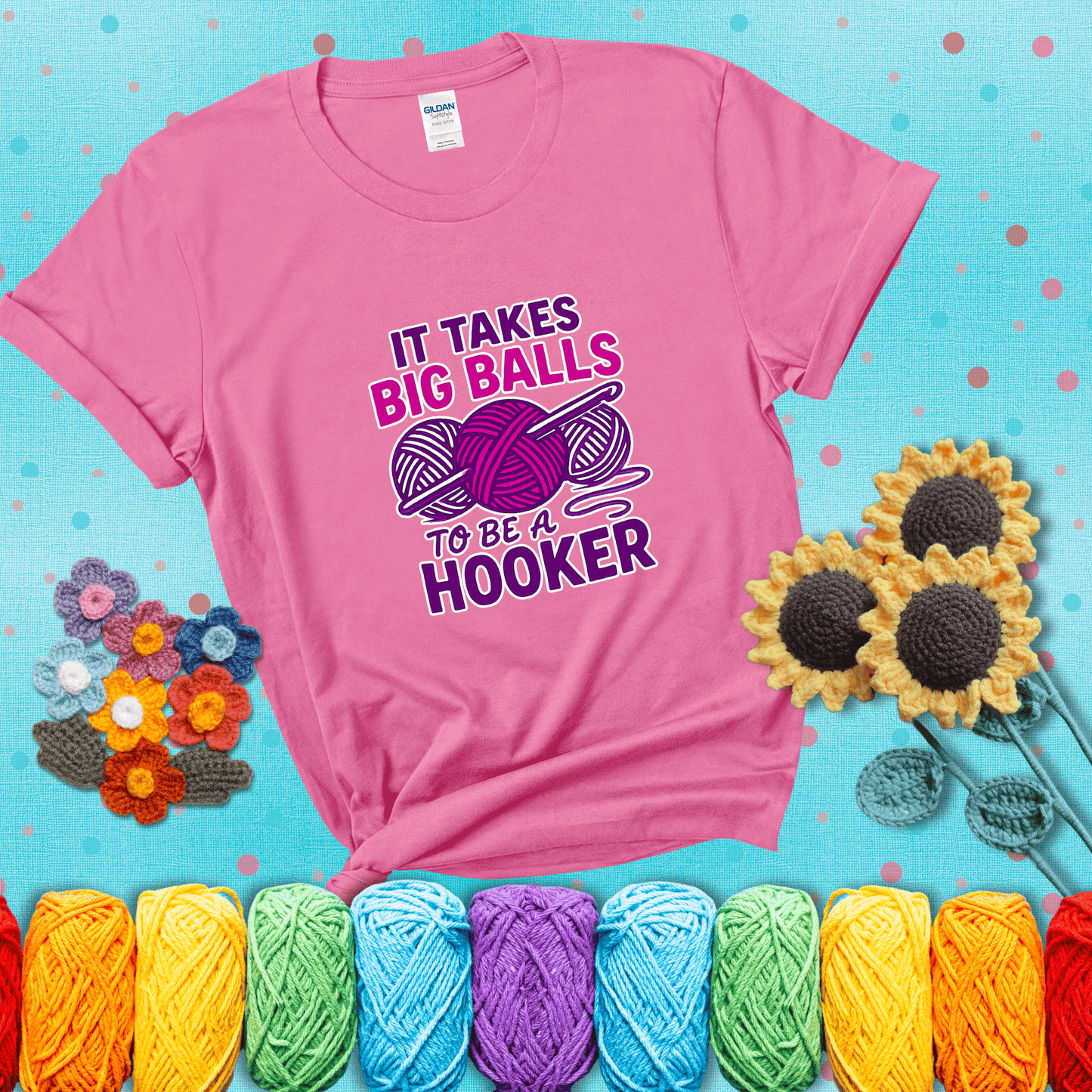 Bigger yarn, bolder energy Design reads 'It Takes Big Balls To Be A Hooker' , perfect crochet gift for yarn lovers showing a pink tee with a teal sunflower background