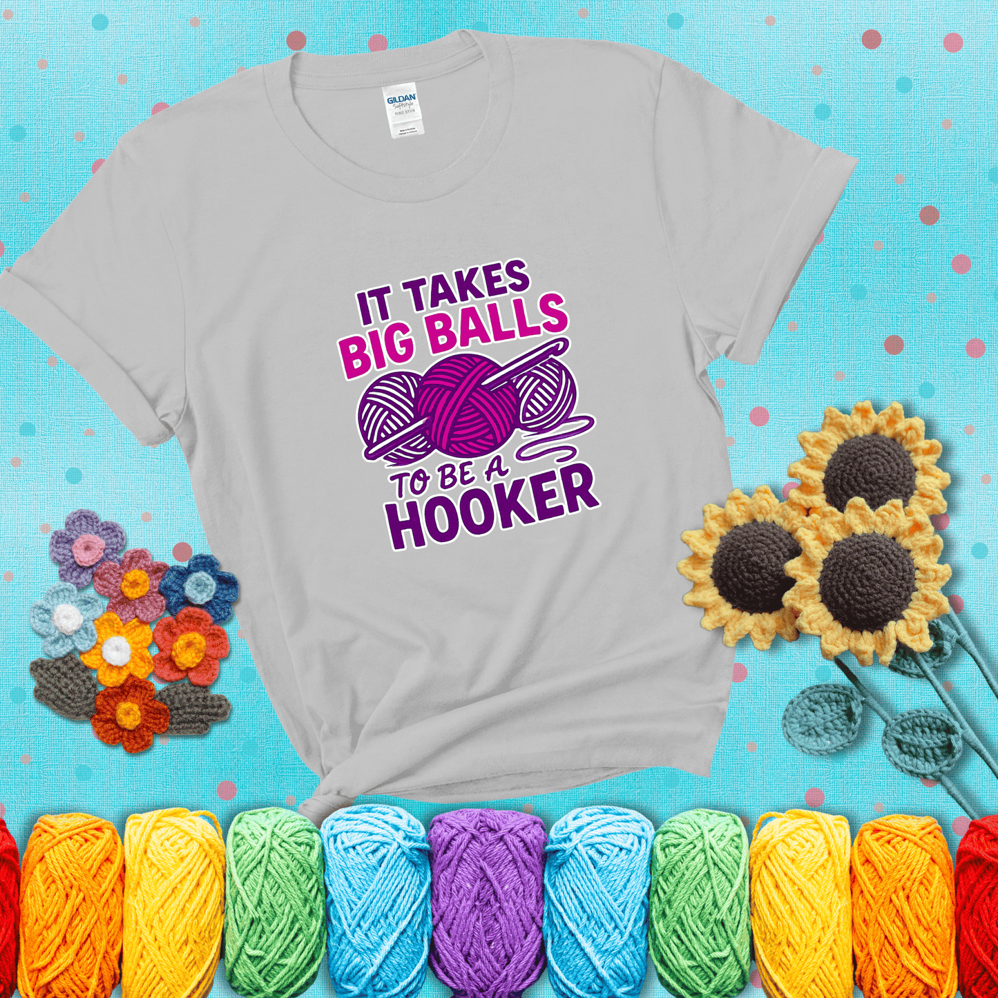 Bigger yarn, bolder energy Design reads 'It Takes Big Balls To Be A Hooker' , perfect crochet gift for yarn lovers showing a light grey tee with a teal sunflower background