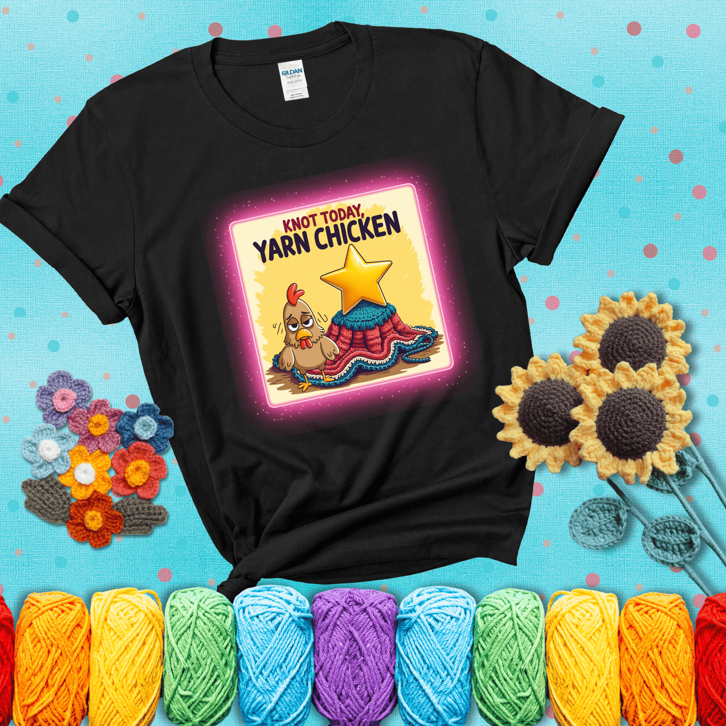 A frazzled cartoon chicken stands next to a nearly-finished project with minimal yarn left, with the phrase “Knot Today, Yarn Chicken” above, showing a black tee with a teal sunflower background
