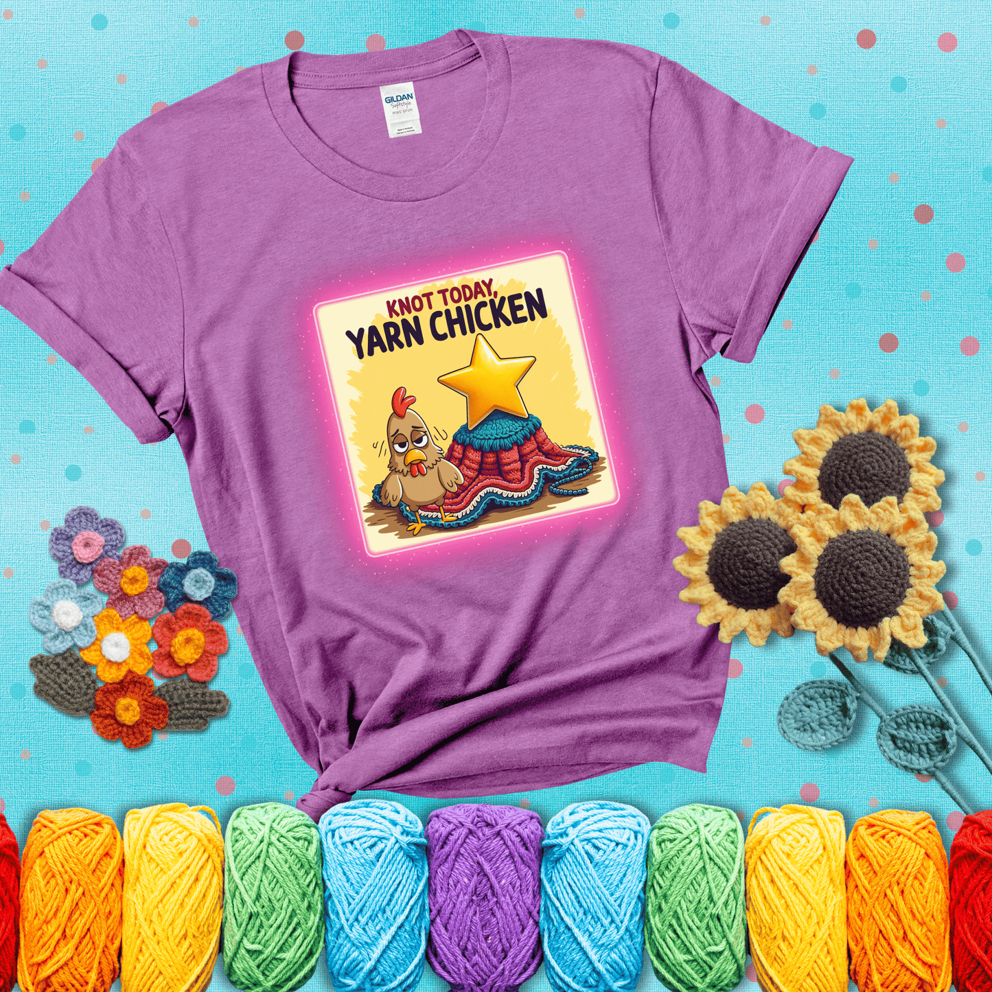 A frazzled cartoon chicken stands next to a nearly-finished project with minimal yarn left, with the phrase “Knot Today, Yarn Chicken” above, showing a light purple tee with a teal sunflower background