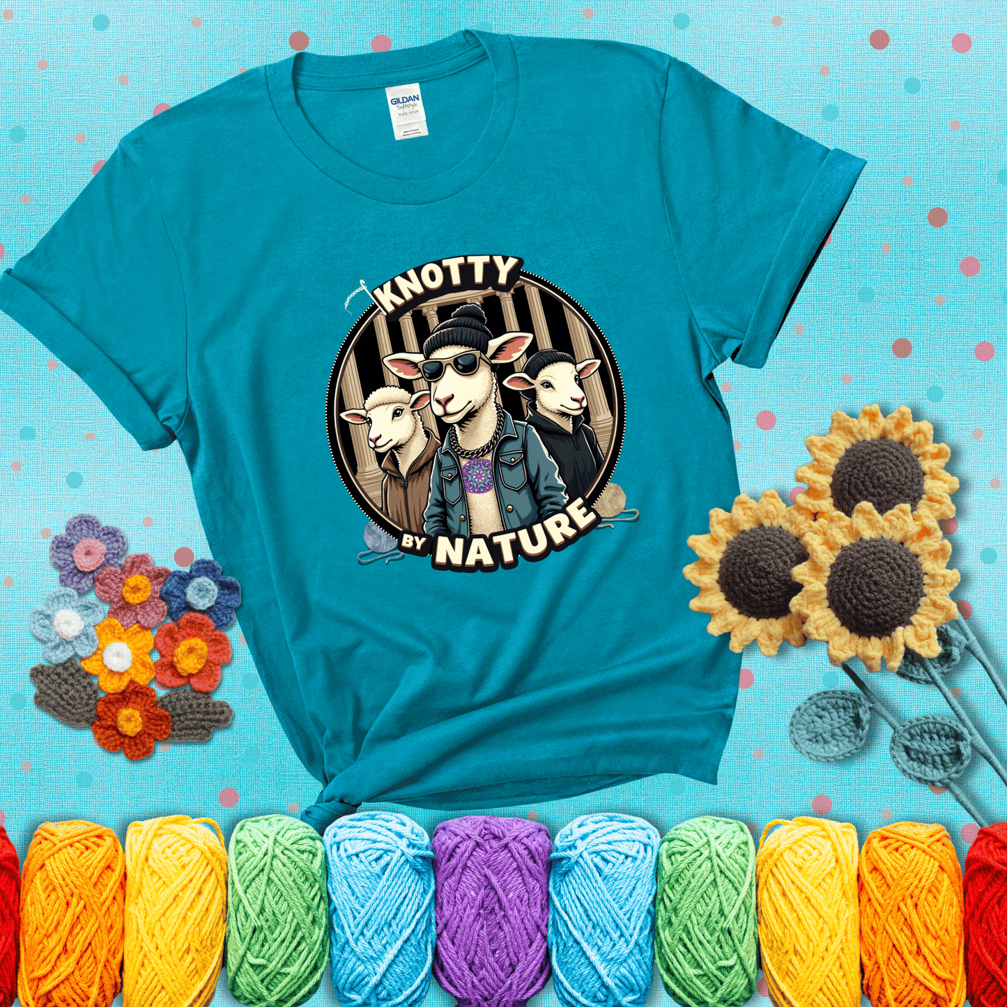 Three cool sheep dressed in urban streetwear pose in front of columns, with bold text “Knotty By Nature,” a hilarious crochet parody with swagger showing a blue-green tee with a teal sunflower background