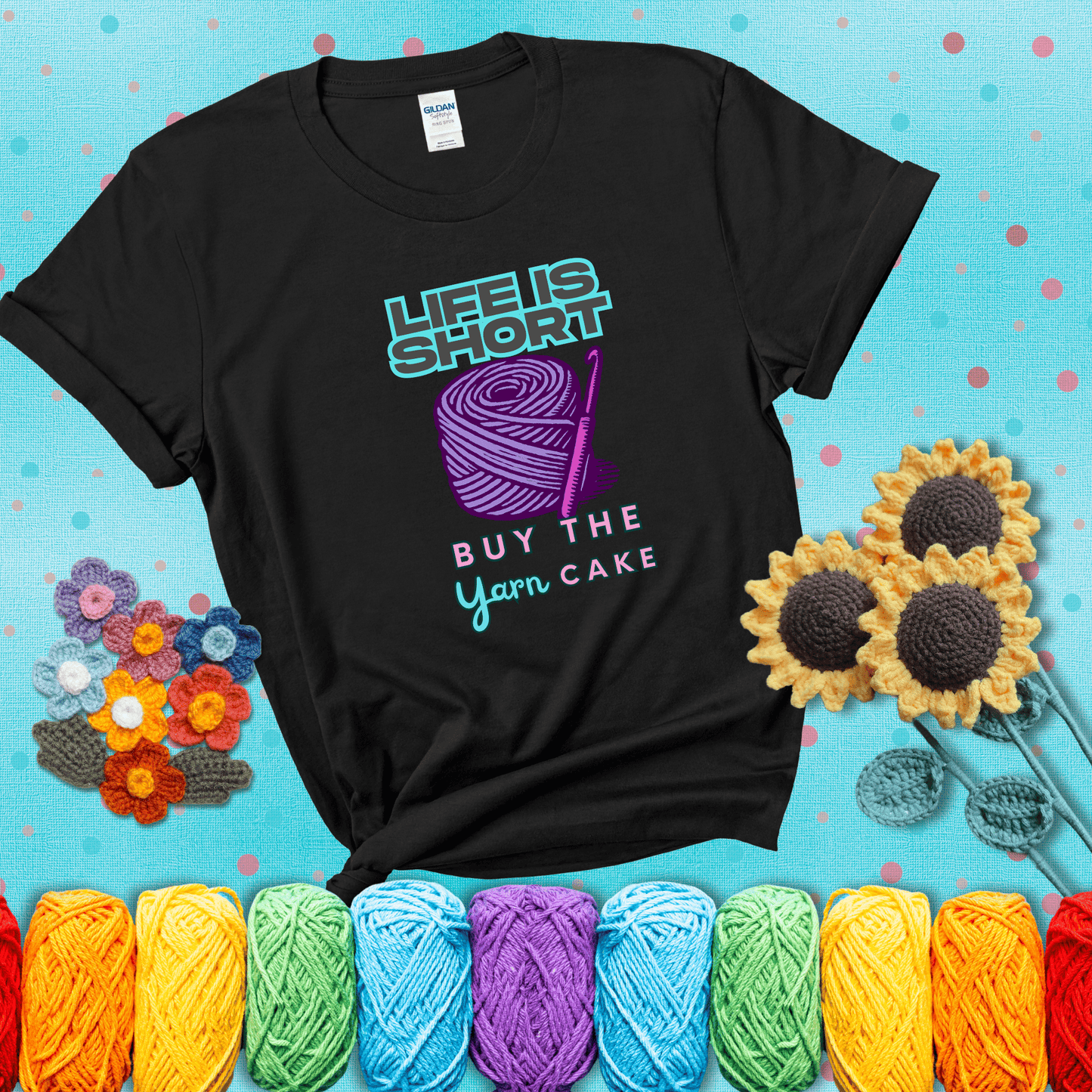No regrets, just yarn Design reads 'Life Is Short. Buy The Yarn (Cake)' , perfect crochet gift for yarn lovers, showing a black tee with a teal sunflower background