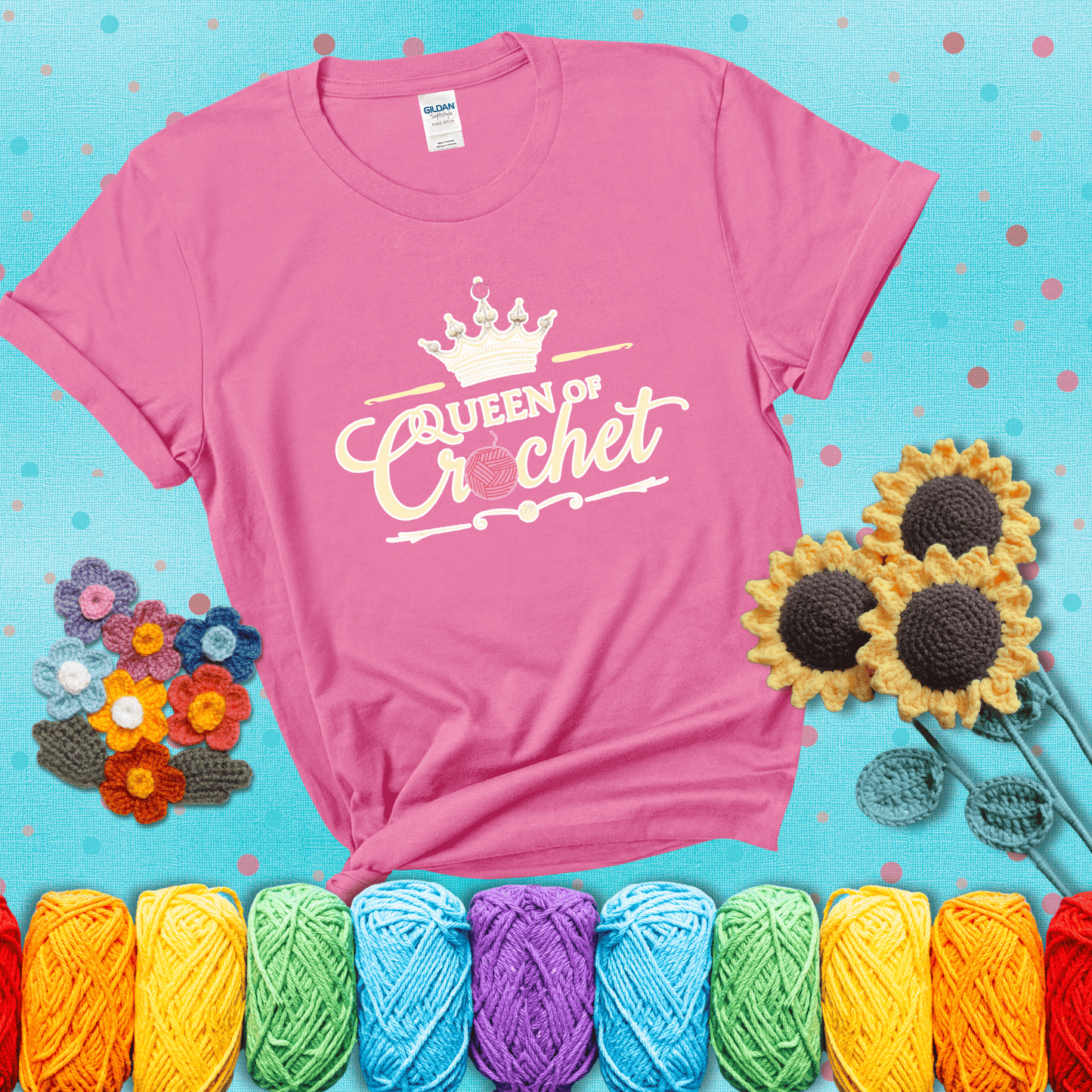 Crown-topped design reads “Queen of Crochet” with elegant script and two pink yarn balls, one forming the letter “o” and another atop the crown showing a pink tee with a teal sunflower background