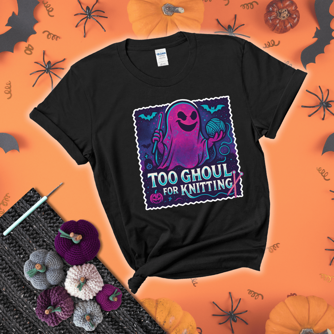 A spooky ghost holds a yarn ball and crochet hook in a vibrant Halloween palette with bats, tombstones, and pumpkins wearing a black tee with a festive halloween background