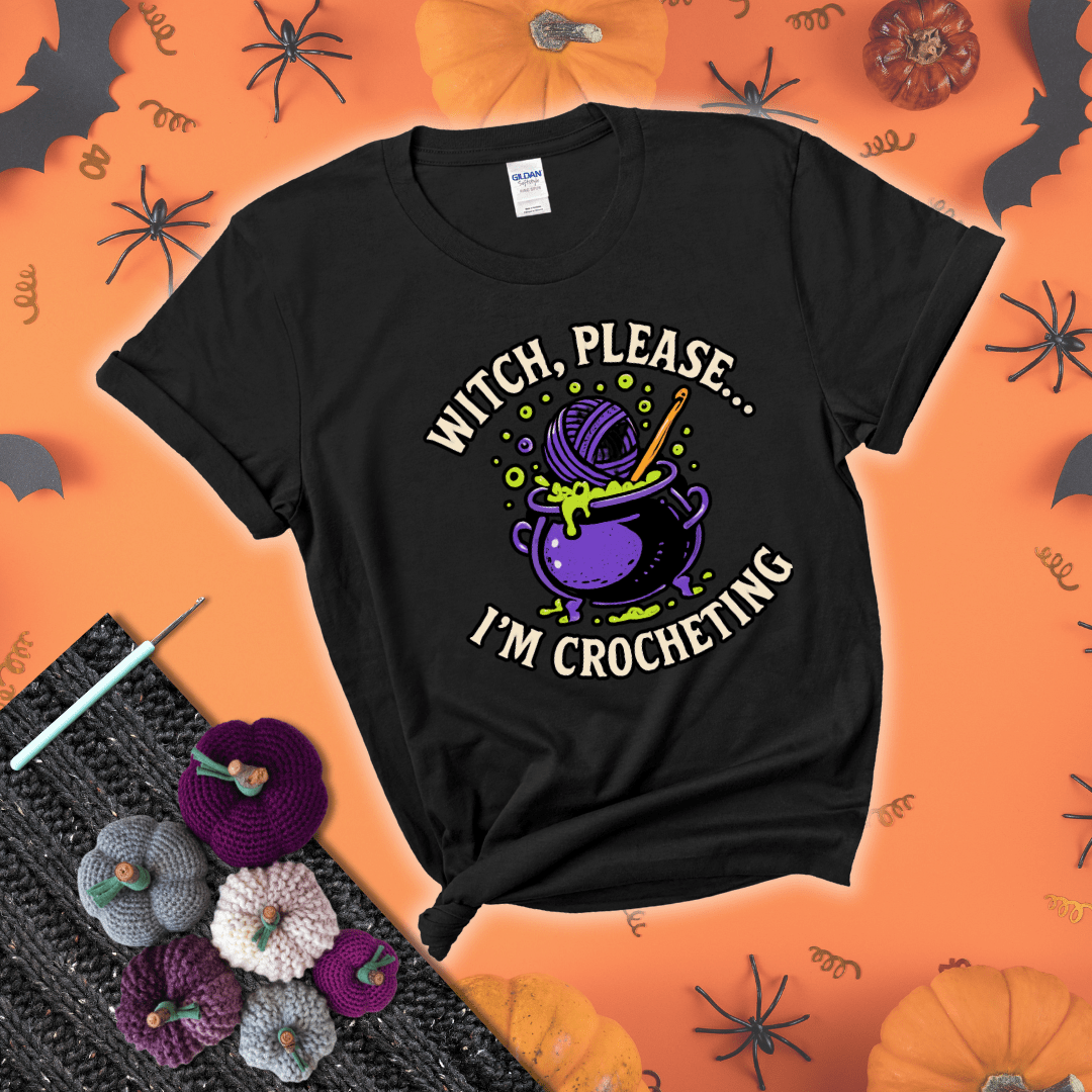 Put a spell on your stash Design reads 'Witch, Please… I’m Crocheting,' perfect crochet gift for yarn lovers showing a black tee with a festive Halloween background