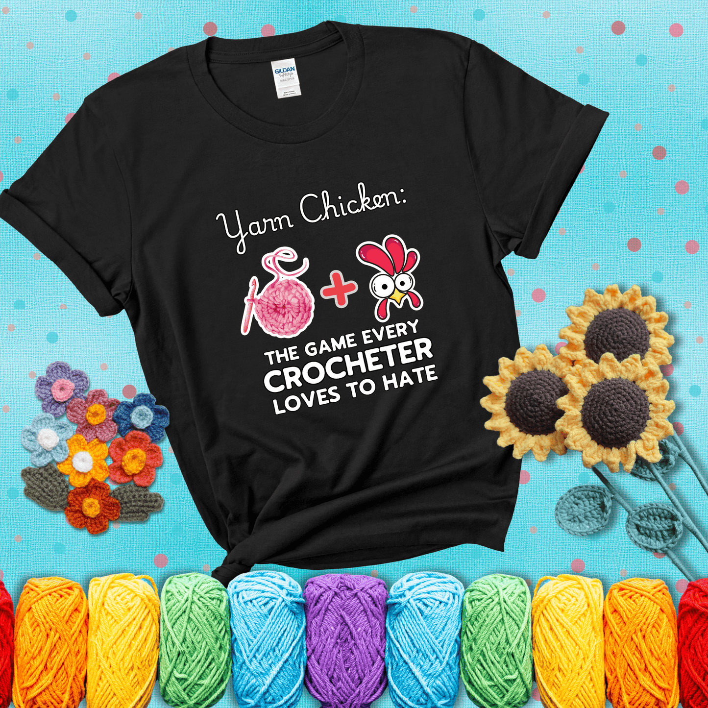 Cartoon chicken inside a yarn ball with crochet circle background. Text reads: “Yarn Chicken: The Game Every Crocheter Loves to Lose.” A fun and relatable tee for fiber artists who like to live on the edge, showing a black tee with a teal sunflower background