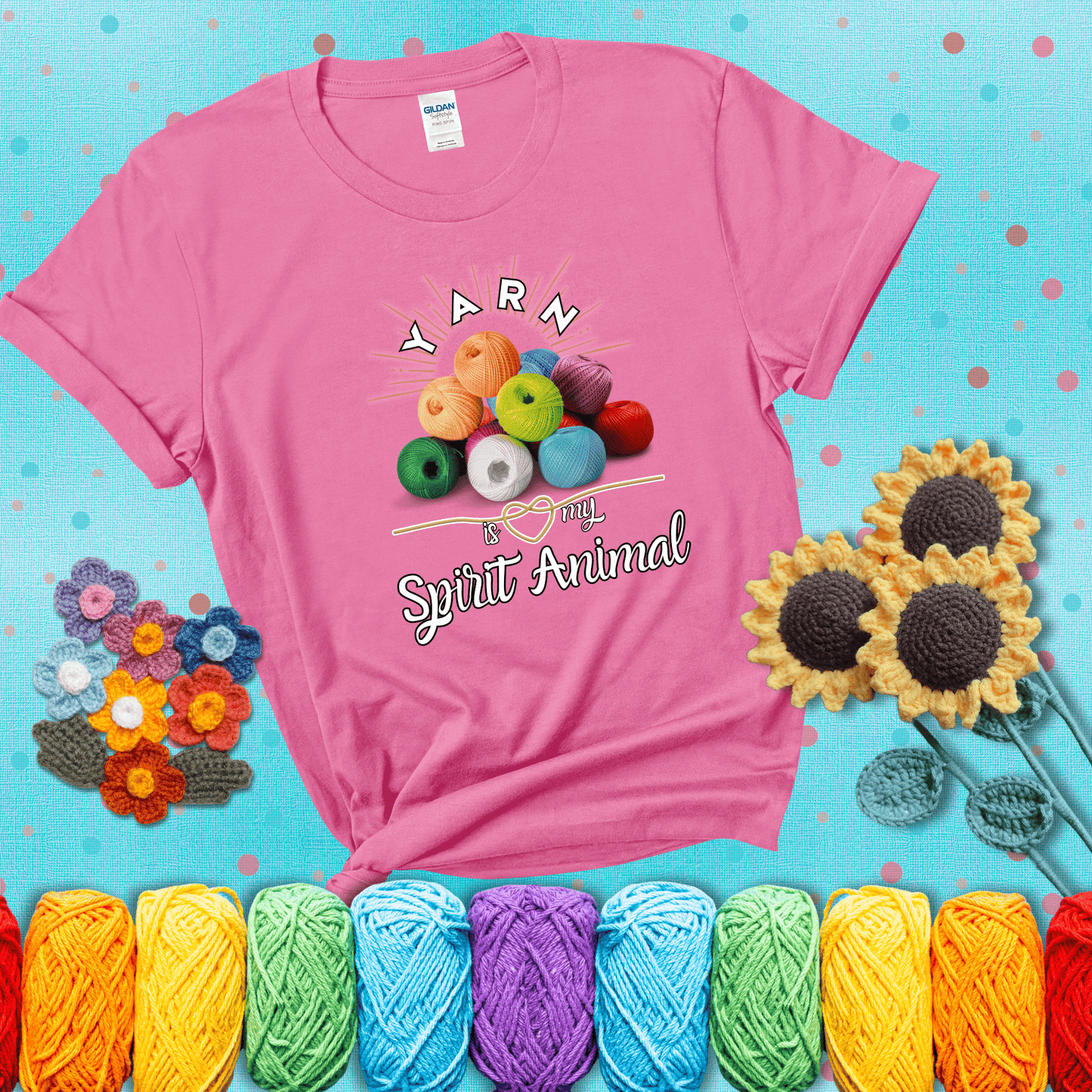 Stack of colorful yarn balls with radiant glow. Text reads: “Yarn Is My Spirit Animal.” A calming and colorful tee for fiber lovers who find zen in stitching, showing a pink tee with a teal sunflower background