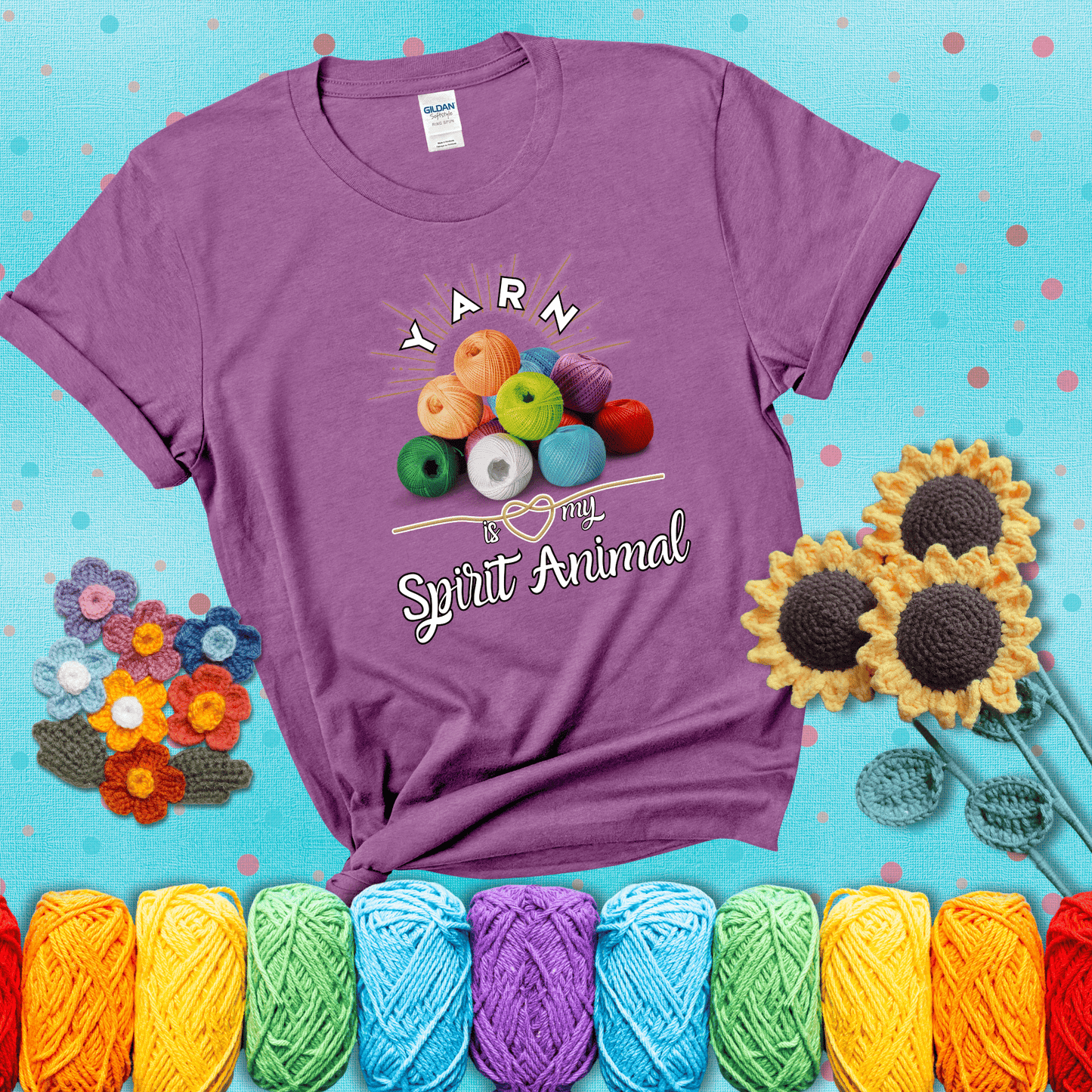 Stack of colorful yarn balls with radiant glow. Text reads: “Yarn Is My Spirit Animal.” A calming and colorful tee for fiber lovers who find zen in stitching, showing a light purple tee with a teal sunflower background