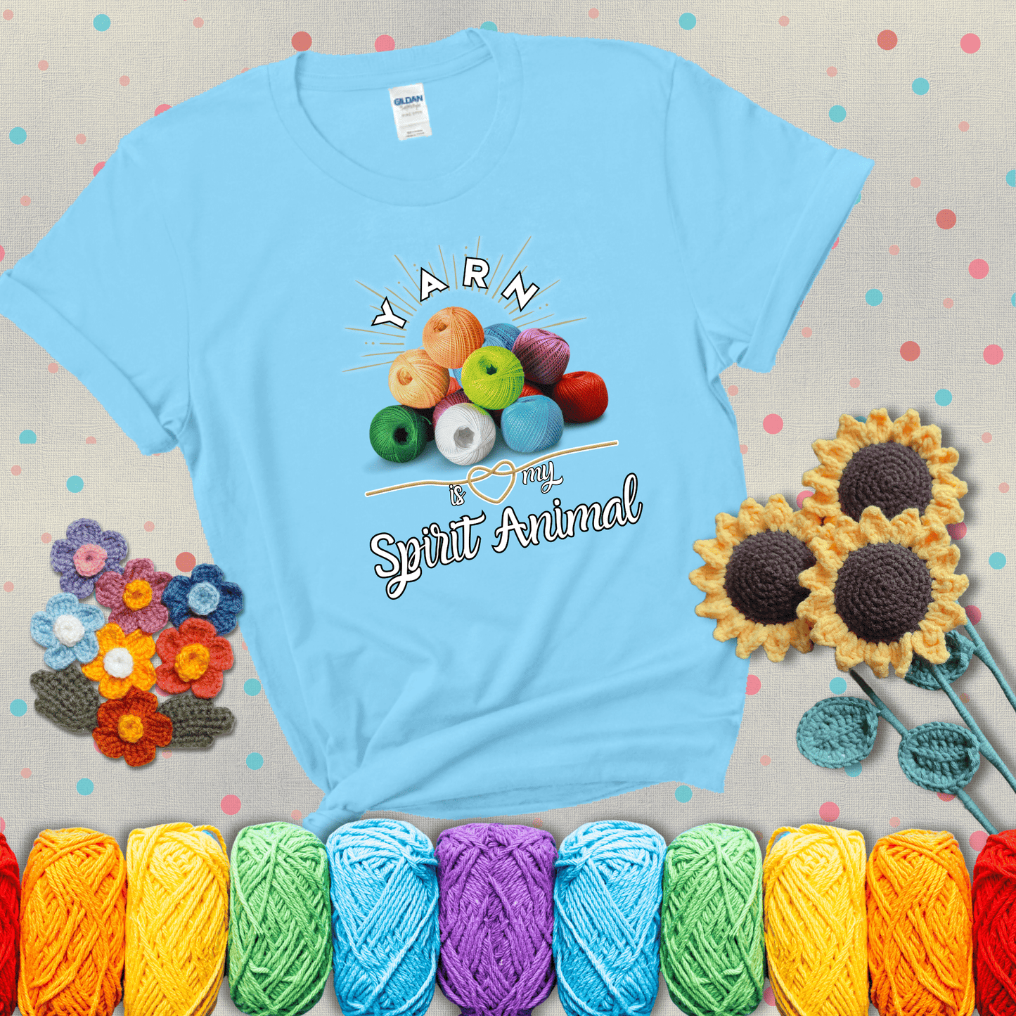 Stack of colorful yarn balls with radiant glow. Text reads: “Yarn Is My Spirit Animal.” A calming and colorful tee for fiber lovers who find zen in stitching, showing a light blue tee with grey sunflower background