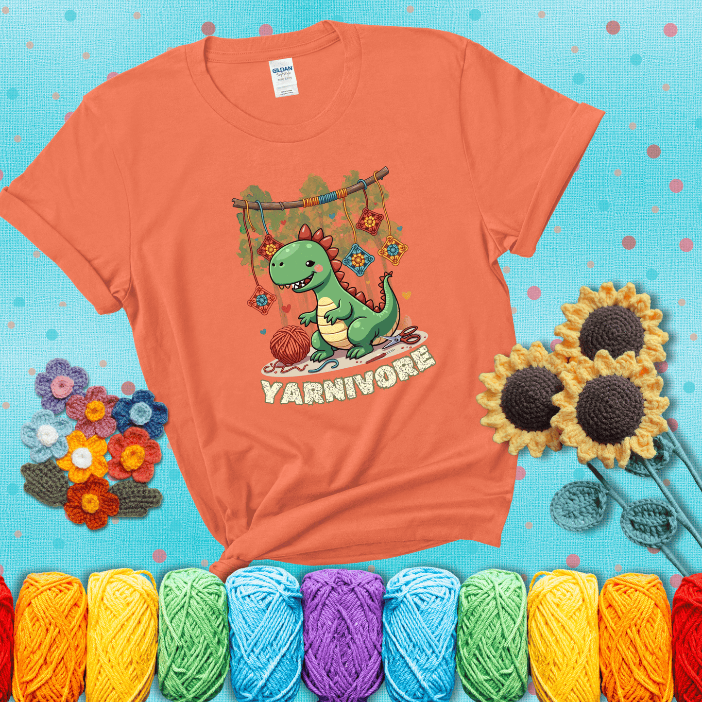 Silly dinosaur chomping on yarn skeins. Text reads: “Yarnivore.” A fun and quirky tee for yarn-obsessed crafters with big appetites, showing a light orange tee with a teal sunflower background
