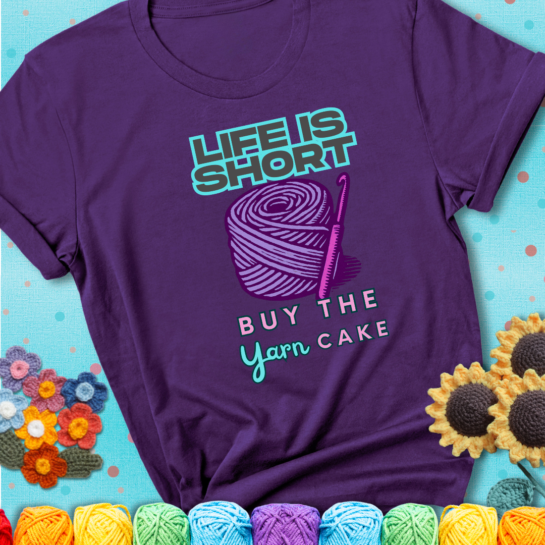 No regrets, just yarn. Design reads 'Life Is Short. Buy The Yarn (Cake)' , perfect crochet gift for yarn lovers, showing a purple tee with a teal sunflower background