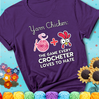 Cartoon chicken inside a yarn ball with crochet circle background. Text reads: “Yarn Chicken: The Game Every Crocheter Loves to Lose.” A fun and relatable tee for fiber artists who like to live on the edge, showing a purple tee with a teal sunflower background