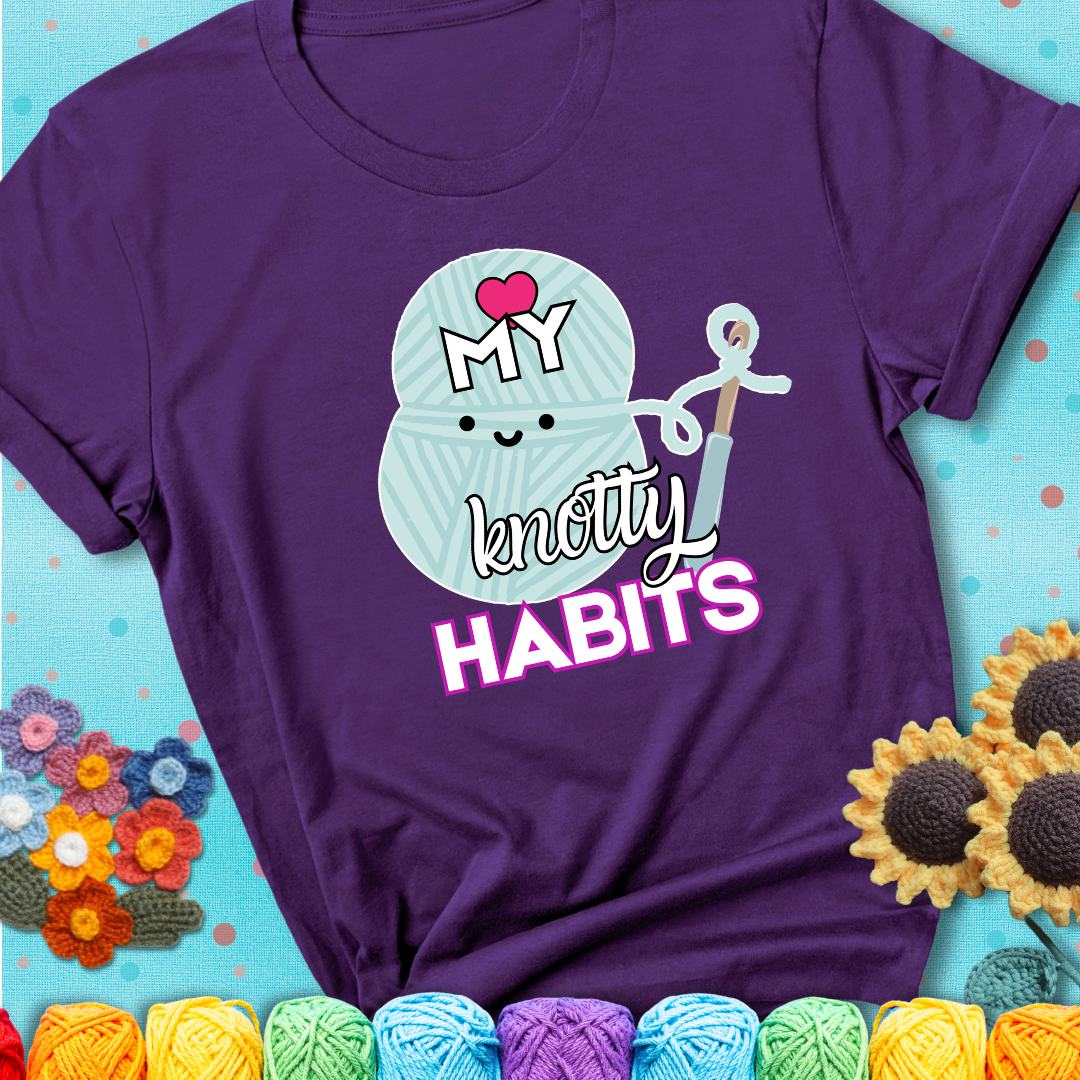 Smiling yarn ball and hook with text “Love My Knotty Habits” - cute crochet shirt with playful design for makers, showing a purple tee with a teal sunflower background