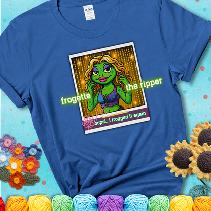 Retro-styled illustration of a glamorous green frog in a sparkly outfit, labeled "Frogette the Ripper" with the phrase “Oops! I frogged it again” below, referencing both crochet and pop culture showing a blue tee with a teal sunflower background