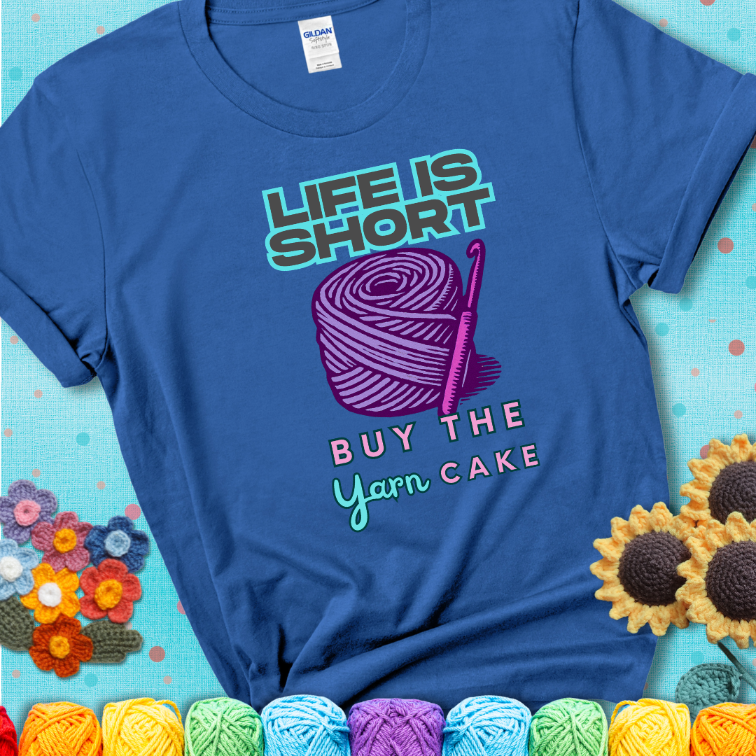 No regrets, just yarn. Design reads 'Life Is Short. Buy The Yarn (Cake)' , perfect crochet gift for yarn lovers, showing a blue tee with a teal sunflower background