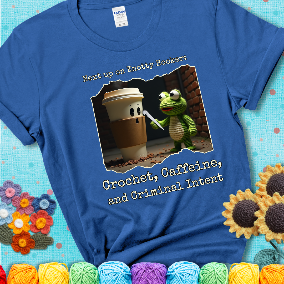 A crocheted frog holding a crochet hook confronts a surprised coffee cup in a dim alleyway with text: "Next up on Knotty Hooker: Crochet, Caffeine, and Criminal Intent," showing a blue tee with a teal sunflower background