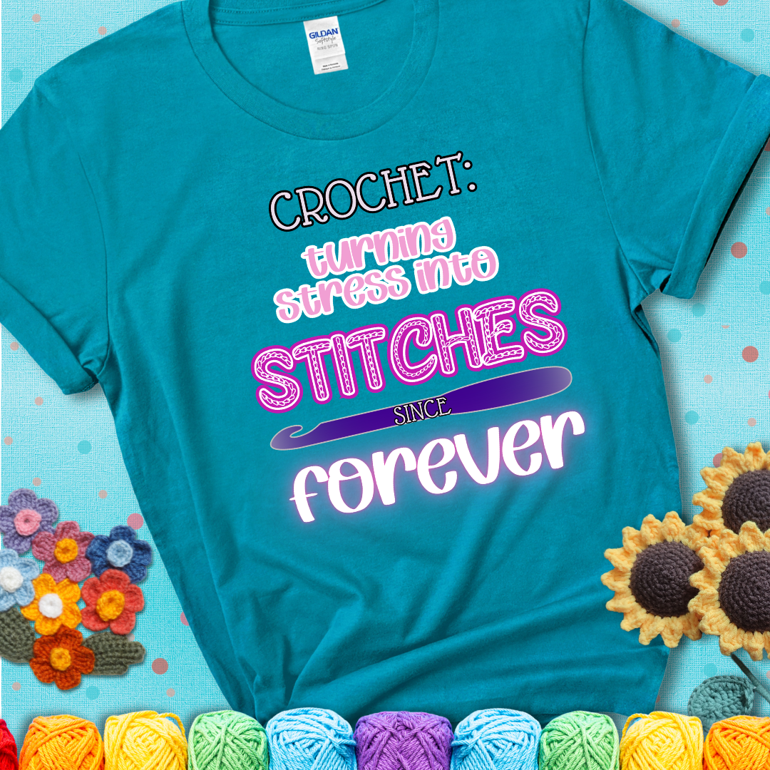 When life gets tangled, we stitch it out Design reads 'Crochet: Turning Stress Into Stitches Since Forever' , perfect crochet gift for yarn lovers; showing a blue-green teal tee with a teal sunflower background