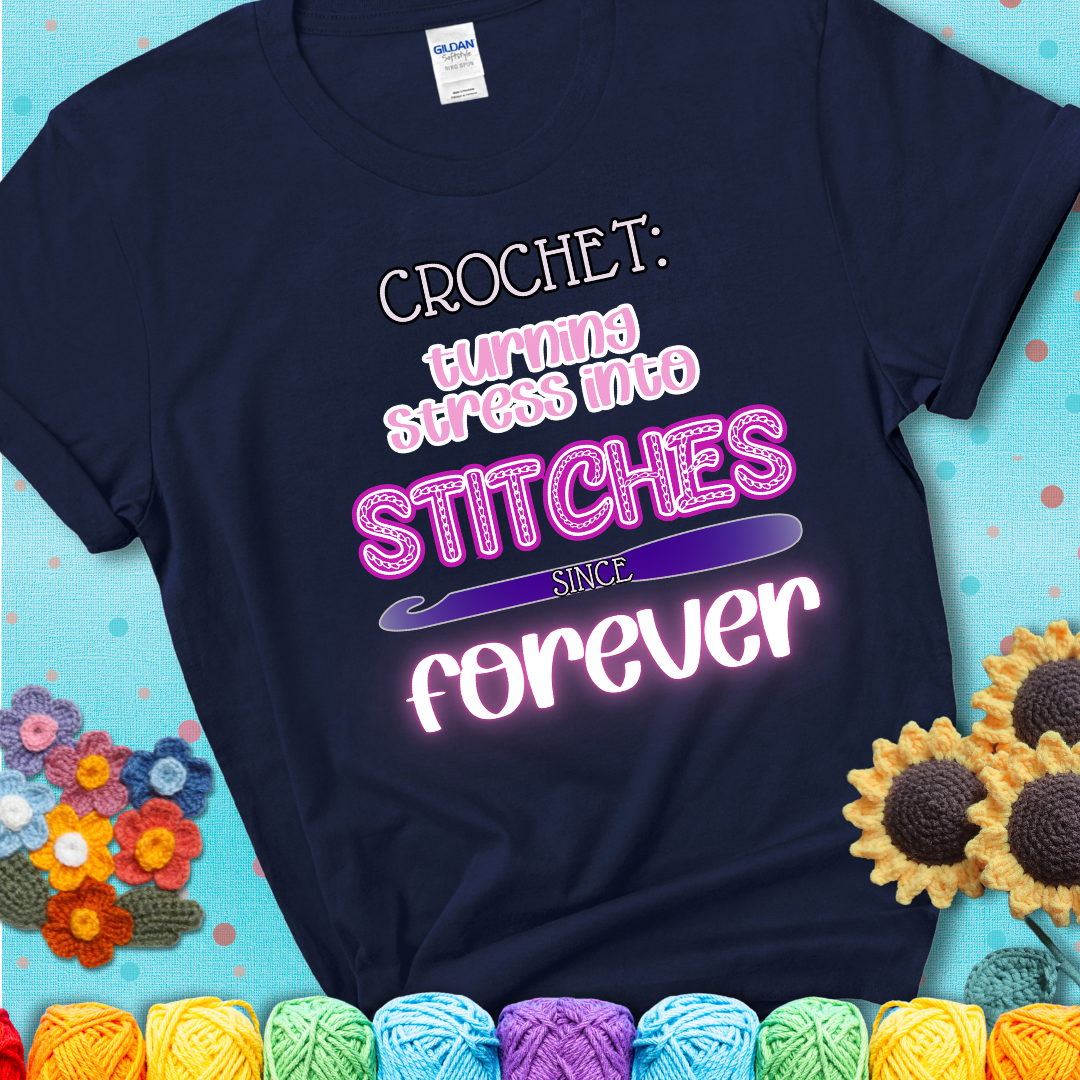 When life gets tangled, we stitch it out Design reads 'Crochet: Turning Stress Into Stitches Since Forever' , perfect crochet gift for yarn lovers; showing a navy blue tee with a teal sunflower background