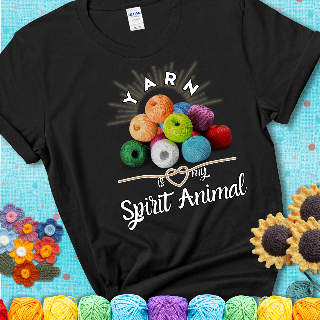 Stack of colorful yarn balls with radiant glow. Text reads: “Yarn Is My Spirit Animal.” A calming and colorful tee for fiber lovers who find zen in stitching, showing a black tee with a teal sunflower background