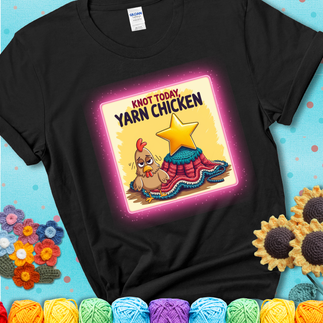 A black t-shirt showing a frazzled cartoon chicken stands next to a nearly-finished project with minimal yarn left, with the phrase “Knot Today, Yarn Chicken” above.